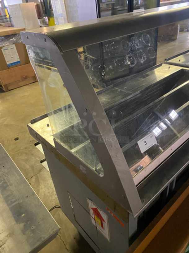 AMAZING! Duke Stainless Steel Commercial Subway Prep Line w/ Lowering Sneeze Guards. (1) Hot Well, (2) Refrigerated Prep Tables, (1) Point of Sale Station, 4 In Counter Cup Dispensers, (4) Chip Merchandisers, Credit Card Machine Mount and Rear Lower Dry Storage. Separates Into 4 Pieces! Model: SWD70060FLM SN: 10100312 120V 60HZ 1 Phase, Model: SWH70025FLM SN: 09103602 120V 60HZ 1 Phase, Model: SUBCPTC60M SN: 10100174 120V 60HZ 1 Phase - Image 3 of 12
