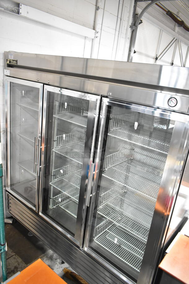 True T-72G Stainless Steel Commercial 3 Door Reach In Cooler Merchandiser w/ Poly Coated Racks on Commercial Casters. 115 Volts, 1 Phase. Tested and Working! - Image 1 of 9