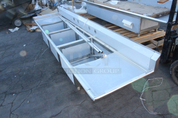BRAND NEW SCRATCH & DENT! Regency 600S324242 124" 16-Gauge Stainless Steel Three Compartment Commercial Sink with 2 Drainboards - 24" x 24" x 14" Bowls. Appears to be missing 3 of the legs.  - Image 7 of 7
