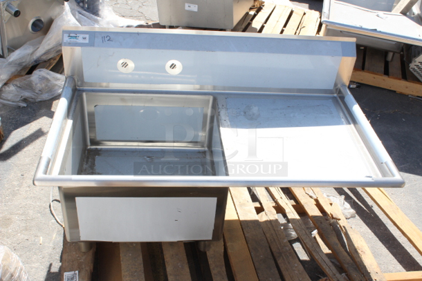 BRAND NEW SCRATCH & DENT! Regency 16 Gauge Stainless Steel One Compartment Commercial Sink and 1 Right Side Drainboard - 23" x 23" x 12" Bowl. Damaged where the legs connect, back right corner. see photos.  - Image 2 of 6