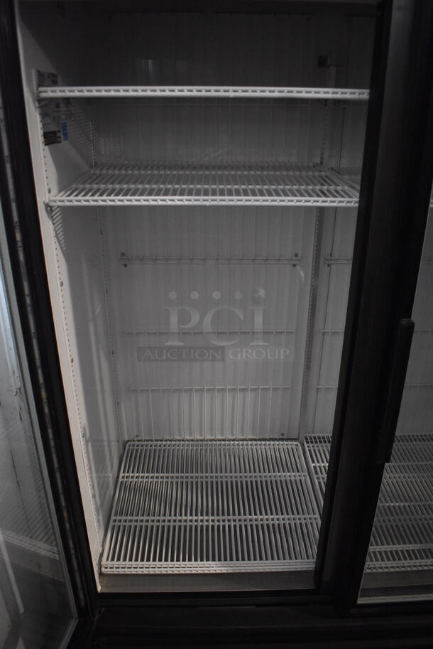 2014 True GDM-72F-LD Commercial Free Standing Electric Powered Triple Swing Glass Door Merchandiser Freezer In Black With Polycoated Racks. 115V/1 Phase Could Not Test Due To Different Plug Style - Image 5 of 8