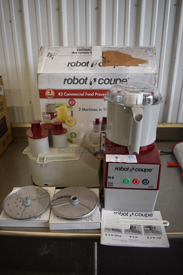 BRAND NEW IN BOX! Robot Coupe Model R2N Metal Commercial Countertop Food Processor w/ Bowl, Lid, S Blade, Continuous Feed Head, 27577 Grater Blade, 27566 Slicer Blade. 120 Volts, 1 Phase. 8x11x18. Tested and Working!