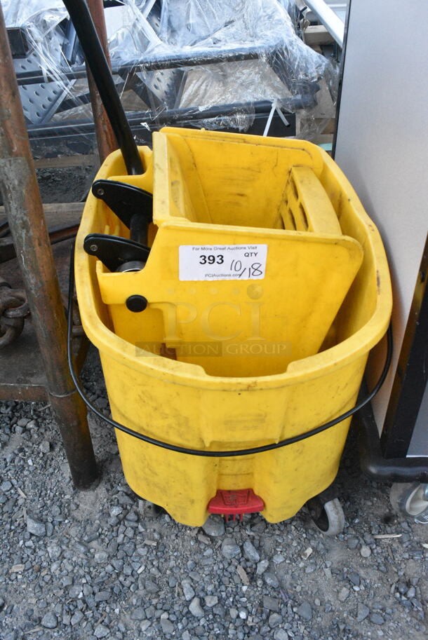 Yellow Poly Mop Bucket w/ Wringing Attachment on Casters.  - Image 1 of 6
