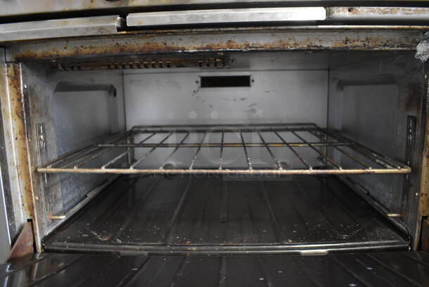 Garland SunFire Stainless Steel Commercial Natural Gas Powered 6 Burner Range w/ Oven and Back Splash on Commercial Casters. 36x34x45 - Image 6 of 7