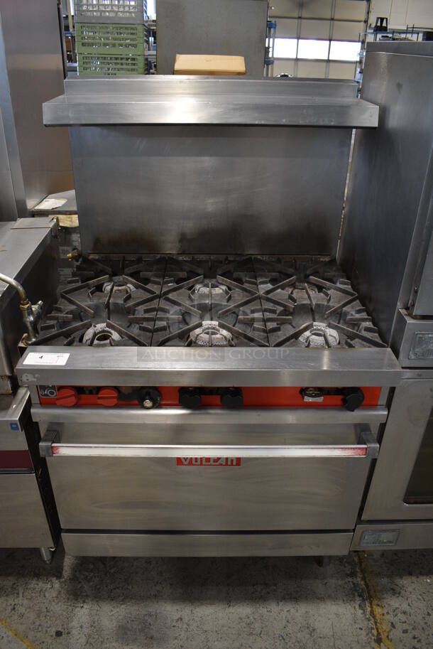 Vulcan 36L-574 Stainless Steel Commercial Natural Gas Powered 6 Burner Range w/ Oven, Over Shelf and Back Splash on Commercial Casters. 36x31x61