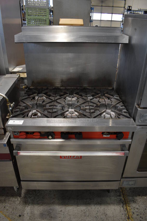 Vulcan 36L-574 Stainless Steel Commercial Natural Gas Powered 6 Burner Range w/ Oven, Over Shelf and Back Splash on Commercial Casters. 36x31x61 - Image 1 of 9