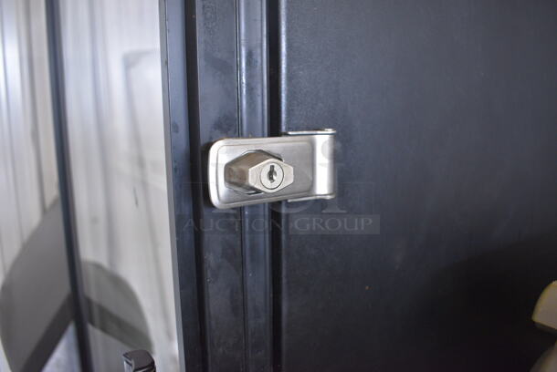 True Model GDM-23 Metal Commercial Single Door Reach In Cooler Merchandiser w/ Poly Coated Racks on Commercial Casters. 115 Volts, 1 Phase. 27x30x81. Tested and Powers On But Temps at 51 Degrees - Image 6 of 6