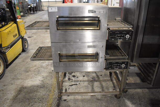 2 Lincoln Impinger 1132 Stainless Steel Commercial Electric Powered Conveyor Pizza Oven on Commercial Casters. 120/208 Volts, 3 Phase. 60x37x60. 2 Times Your Bid!