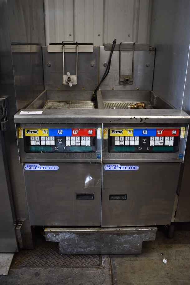 2012 Pitco Frialator Model SSH55 Stainless Steel Commercial Natural Gas Powered 2 Bay Deep Fat Fryer w/ Filtration System on Commercial Casters. 80,000 BTU. 52x35x84