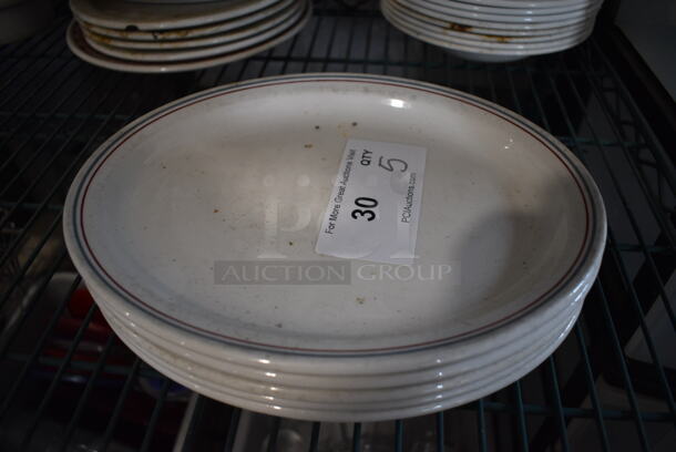 5 White Ceramic Oval Plates w/ Gray and Red Lines on Rim. 11.5x9.5x1. 5 Times Your Bid!
