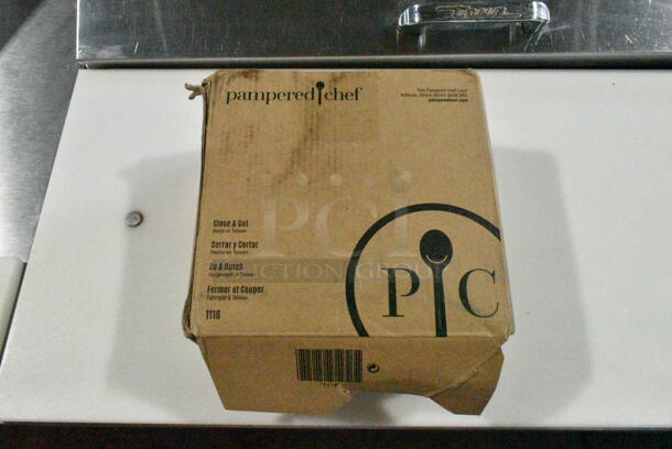 3 BRAND NEW SCRATCH AND DENT! Items Including Pampered Chef Close and Cut, 176CPDPM1BK Choice Black Stackable Countertop 8 - 44 oz. Cup Dispenser Cabinet - 1 Slot and Vitamix 120204 Orange Blender Pitcher. 3 Times Your Bid! - Image 5 of 12