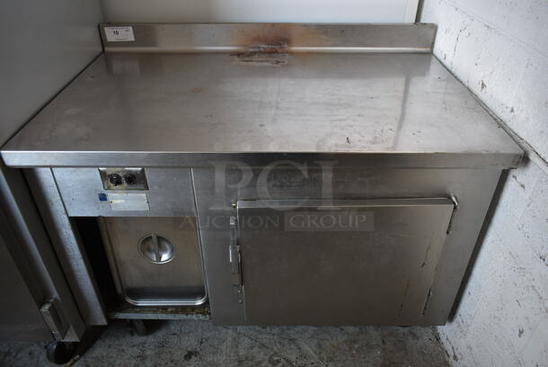 Stainless Steel Commercial Single Door Work Top Cooler w/ Backsplash on Commercial Casters. Tested and Powers On But Does Not Get Cold - Image 1 of 10