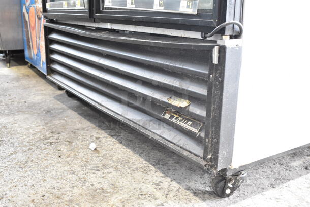 2015 True GDM-49-LD ENERGY STAR Metal Commercial 2 Door Reach In Cooler Merchandiser w/ Poly Coated Racks on Commercial Casters. 115 Volts, 1 Phase. Tested and Working! - Image 3 of 6