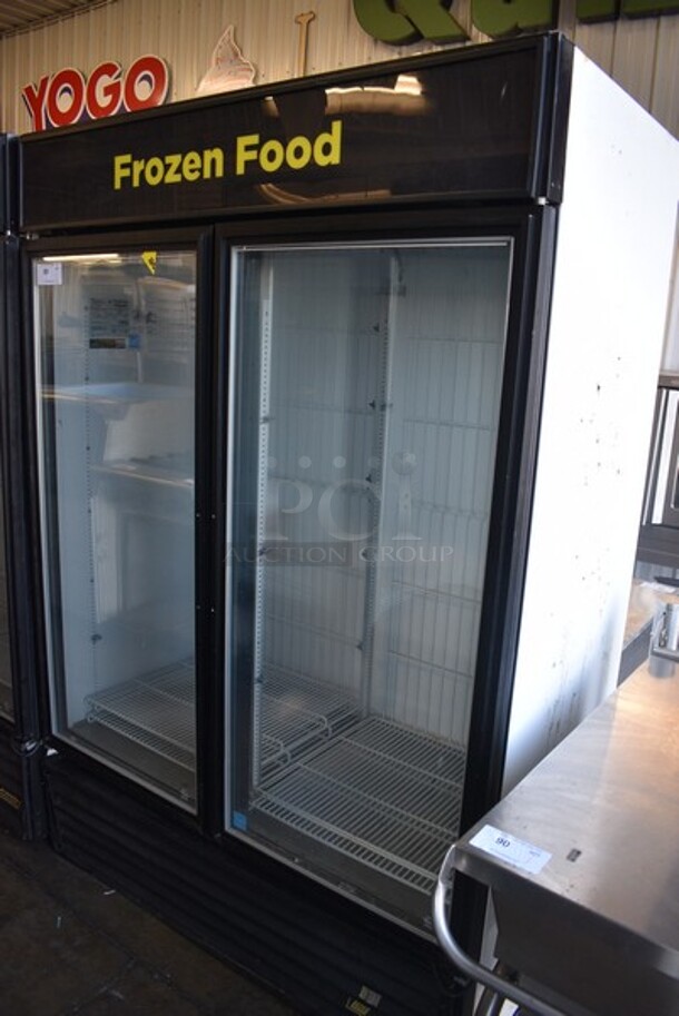 2013 True Model GDM-49F-LD Metal Commercial 2 Glass Door Reach In Freezer Merchandiser w/ Poly Coated Racks. 115/208-230 Volts, 1 Phase. 54x30x76.5.