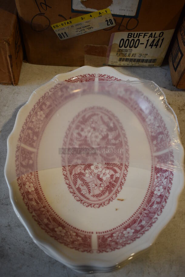 12 BRAND NEW IN BOX! White and Red Ceramic Plates. 12x9.5x1.5. 12 Times Your Bid!