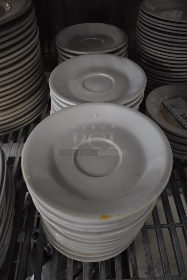 38 White Ceramic Saucers. 7x7x1. 38 Times Your Bid!