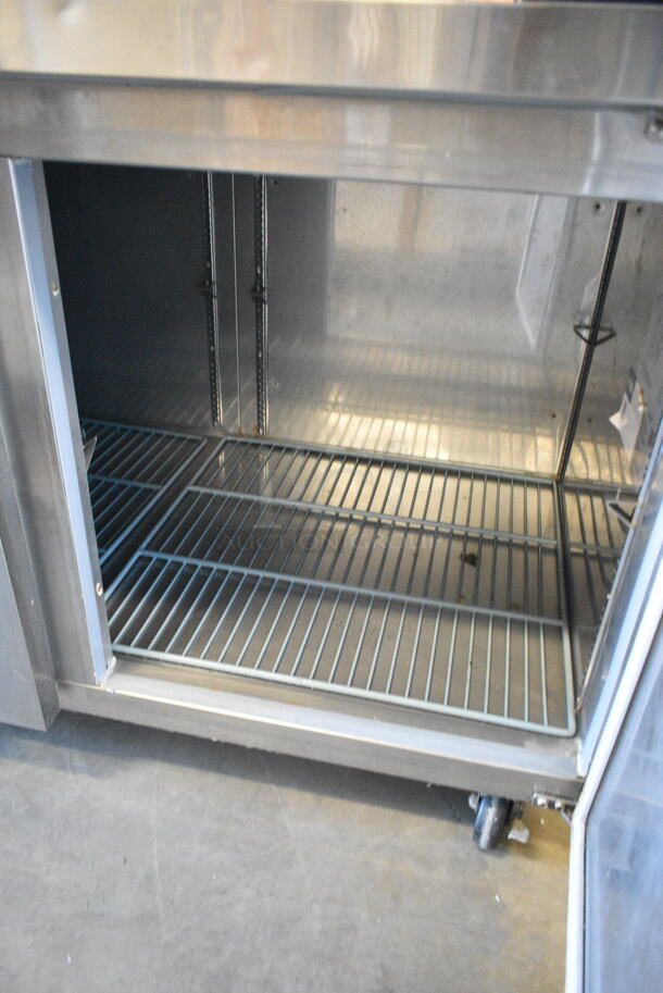 BRAND NEW SCRATCH AND DENT! 2023 Avantco 178SSUD3R Stainless Steel 3 Door Undercounter Cooler on Commercial Casters. 115 Volts, 1 Phase. Tested and Does Not Power On - Image 6 of 8