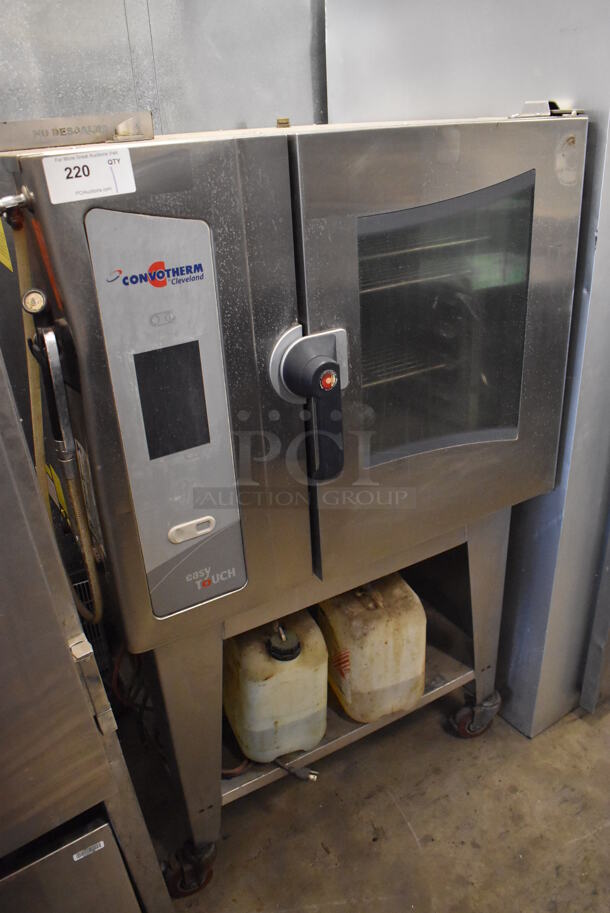 2012 Cleveland OGB-6.10 Stainless Steel Commercial Natural Gas Powered Combi Convotherm Convection Oven w/ View Through Door and Metal Oven Racks on Stand w/ Commercial Casters. 38x32x60