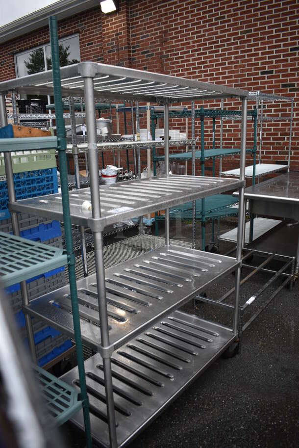 Metal 4 Tier Shelving Unit on Commercial Casters. BUYER MUST DISMANTLE. PCI CANNOT DISMANTLE FOR SHIPPING. PLEASE CONSIDER FREIGHT CHARGES. 48x24x69
