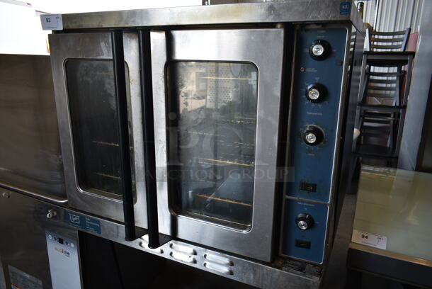 2020 Duke E101-GV Stainless Steel Commercial Gas Powered Full Size Convection Oven w/ View Through Doors, Metal Oven Racks and Thermostatic Controls on Metal Legs. - Image 2 of 8