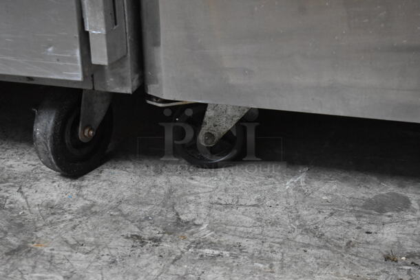 Turbo Air M3R47-2 Stainless Steel Commercial 2 Door Reach In Cooler w/ Poly Coated Racks on Commercial Casters. 115 Volts, 1 Phase. Tested and Powers On But Does Not Get Cold - Image 4 of 7