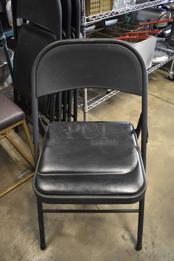 4 Black Metal Folding Chairs w/ Black Seat Cushion. 20x2x34. 4 Times Your Bid!