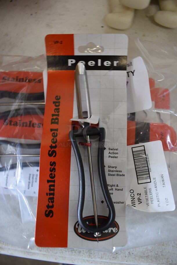 7 BRAND NEW! Winware Metal Peelers. 6