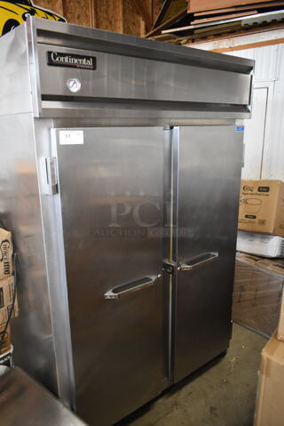 Continental 2R Stainless Steel Commercial 2 Door Reach In Cooler w/ Poly Coated Racks. 115 Volts, 1 Phase. Tested and Powers On But Does Not Get Cold