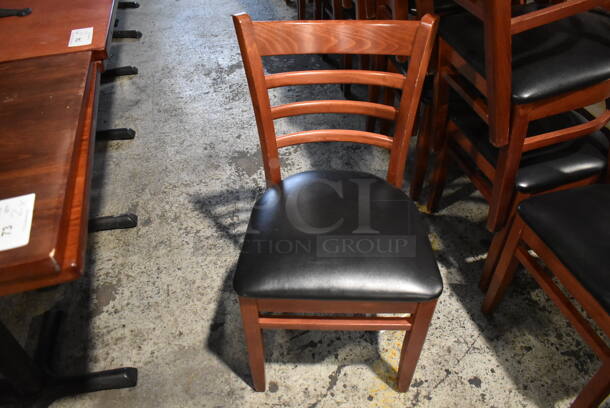 4 Wood Pattern Dining Chairs w/ Black Seat Cushion. Stock Picture - Cosmetic Condition May Vary. 17x18x34. 4 Times Your Bid!