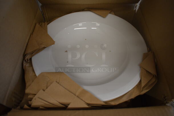 12 BRAND NEW IN BOX! White Ceramic Plates. 12x12x2. 12 Times Your Bid!