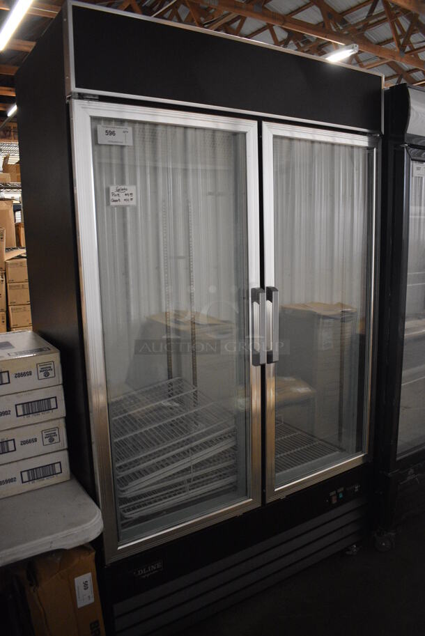 Model D768BM2F-HC Metal Commercial 2 Door Reach In Freezer Merchandiser w/ Poly Coated Racks on Commercial Casters. 115 Volts, 1 Phase. 49x27x82. Tested and Working!