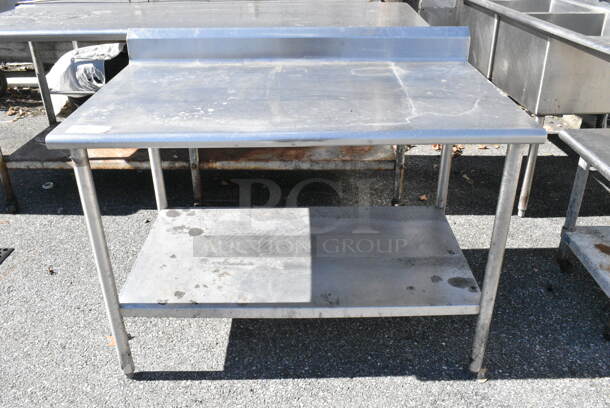 Stainless Steel Table w/ Metal Under Shelf and Back Splash. (out back) - Image 1 of 2