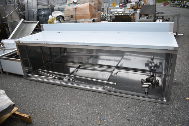 BRAND NEW SCRATCH AND DENT! Regency 600EBTB3096D 30" x 96" 16 Gauge Type 304 Stainless Steel Enclosed Base Sliding Door Table with Adjustable Midshelf and 6" Backsplash - Image 2 of 8