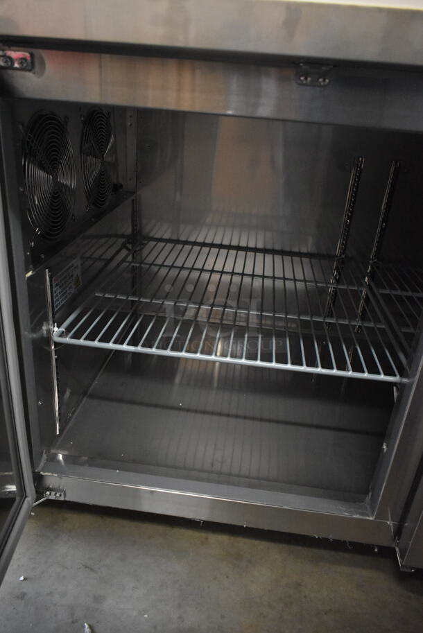 BRAND NEW SCRATCH AND DENT! 2023 Avantco 178SSPPT3 Stainless Steel Commercial Refrigerated Pizza Prep Table on Commercial Casters. 115 Volts, 1 Phase. Tested and Working! - Image 9 of 12