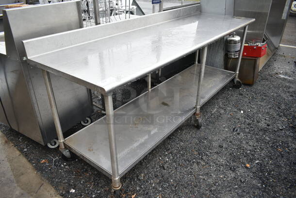 Eagle Stainless Steel Commercial Table w/ Back Splash and Under Shelf on Commercial Casters.  - Image 2 of 4