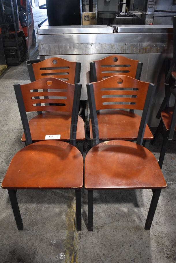 7 Wooden Dining Chairs w/ Black Metal Frame. Stock Picture - Cosmetic Condition May Vary. 17x17x33. 7 Times Your Bid!