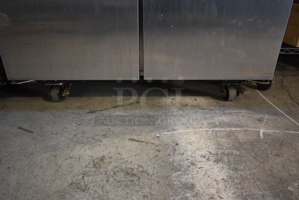 2014 True TG2R-2S ENERGY STAR Stainless Steel Commercial 2 Door Reach In Cooler w/ Poly Coated Racks on Commercial Casters. 115 Volts, 1 Phase. Tested and Working! - Image 4 of 8