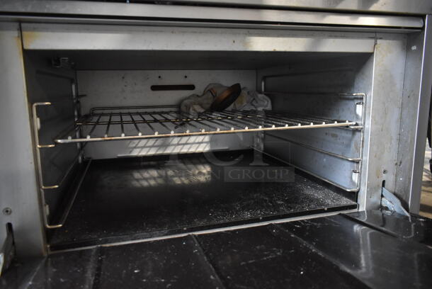 Vulcan Stainless Steel Commercial Natural Gas Powered 6 Burner Range w/ Oven, Over Shelf and Back Splash on Commercial Casters.  - Image 6 of 6