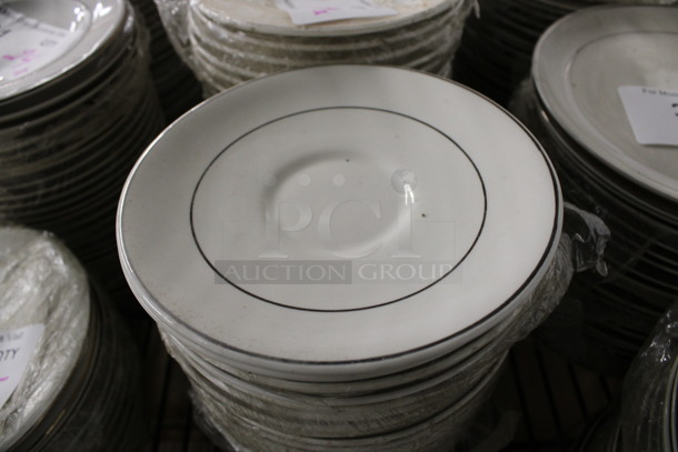 30 White Ceramic Saucers w/ Silver Colored Lines on Rim. 6.25x6.25x1. 30 Times Your Bid!
