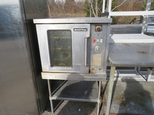 One Market Forge Half Size Electric Convection Oven One Stainless Table With Under Shelf On Casters. Model# 4200. 230 Volt. 1 Phase. 30X30X53