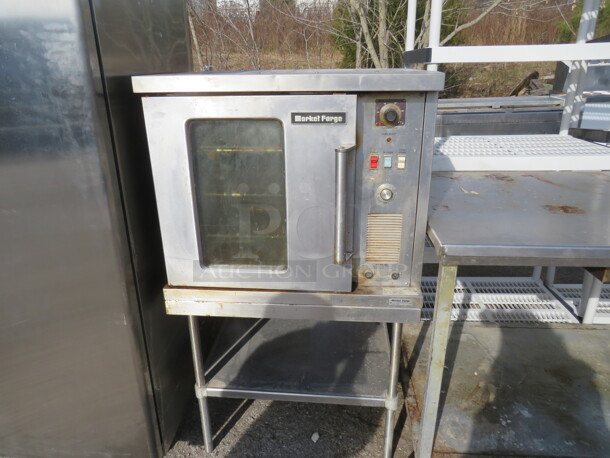 One Market Forge Half Size Electric Convection Oven One Stainless Table With Under Shelf On Casters. Model# 4200. 230 Volt. 1 Phase. 30X30X53 - Image 1 of 2