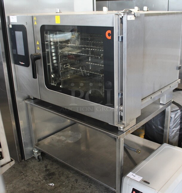 Convotherm C4eT 6.20 GS Stainless Steel Commercial Natural Gas Powered Combination Convection Oven on Stainless Steel Equipment Stand w/ Commercial Casters. 68,200 BTU. - Image 1 of 5
