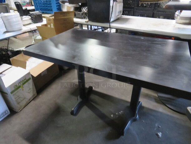 One Black Table Top On Dual Pedestal Base. 48X03X30