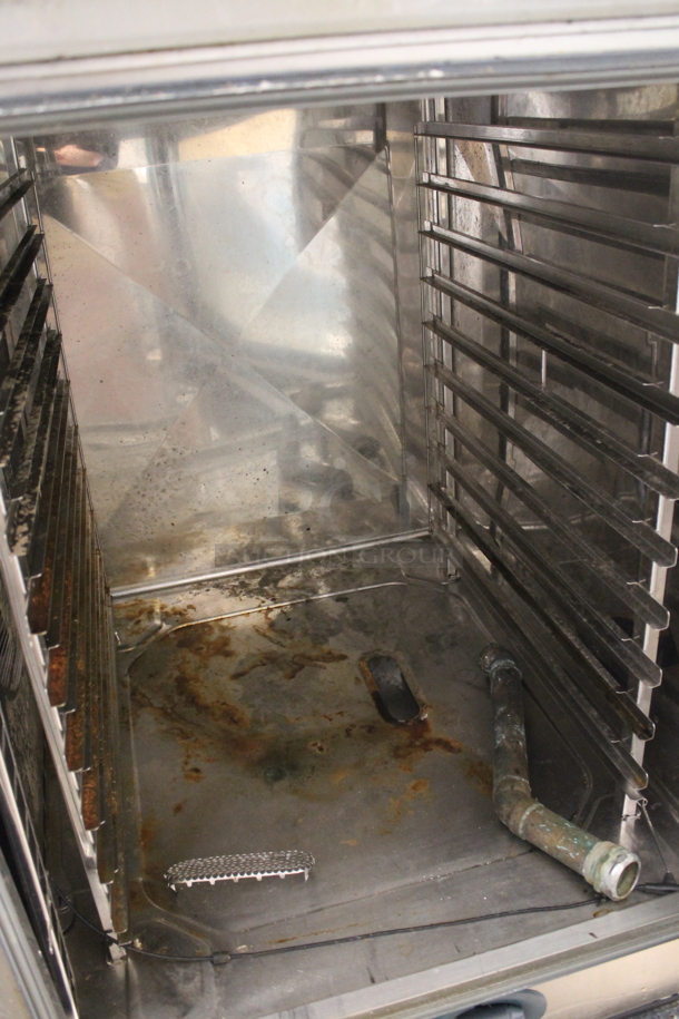 2 2013 Rational Stainless Steel Commercial Combitherm Self Cooking Center Convection Ovens on Commercial Casters. Top Model: SCC WE 62. Bottom Model: SCC WE 102. Picture of Unit Powered on is Included. 480 Volts, 3 Phase. 42x40x73. 2 Times Your Bid! - Image 7 of 9