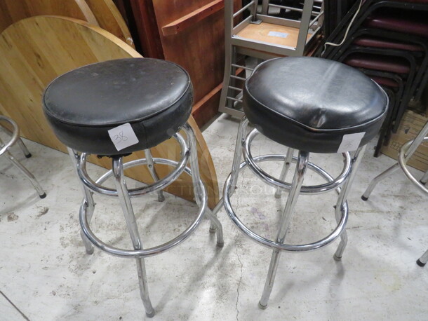 Double Chrome Ring Bar Stool With A Black Cushioned Swivel Seat. Need To Be Recovered. 2XBID - Image 1 of 1