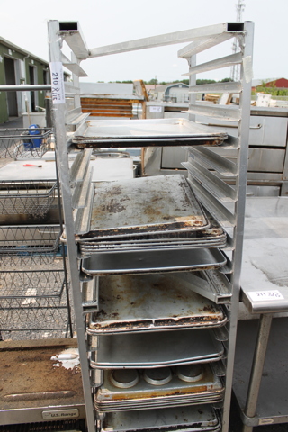 Metal Commercial Pan Transport Rack w/ Various Metal Baking Pans on Commercial Casters. 