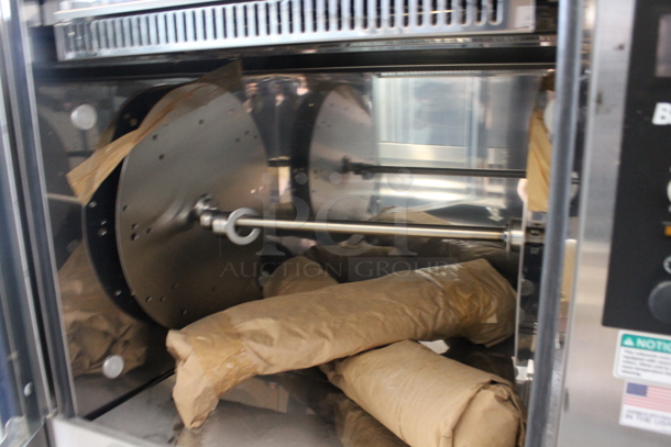 BRAND NEW! BKI VGG-16F Stainless Steel Commercial Electric Powered Rotisserie Oven on Commercial Casters. Stock Picture Used as Gallery Picture. 208 Volts, 3 Phase. Goes GREAT w/ Lot #4! - Image 5 of 11
