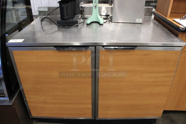 Duke Model SUB-P-48M Stainless Steel Commercial Counter w/ Back Splash and 2 Wood Pattern Doors. 48x30x40