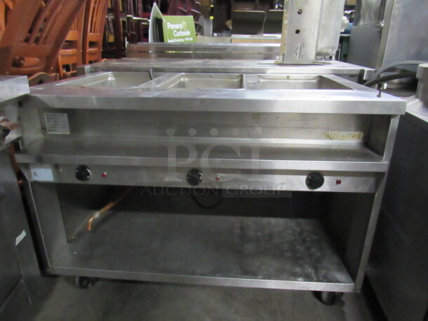 One SS Randell 3 Well Steam Table With Under Storage On Casters. Model#3613-M. 208-240 Volt. 48X32X35