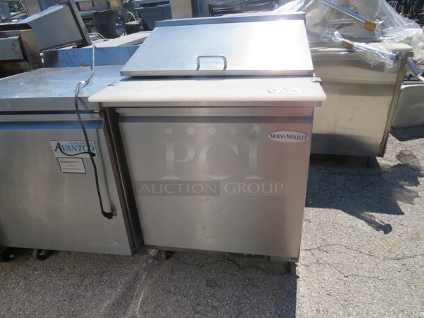 One Serv Ware 1 Door Refrigerated Prep Table With 1 Rack On Casters. Working NOT Cold. Model# SP29-12M. 115 Volt. 29X34X44.  - Image 1 of 2